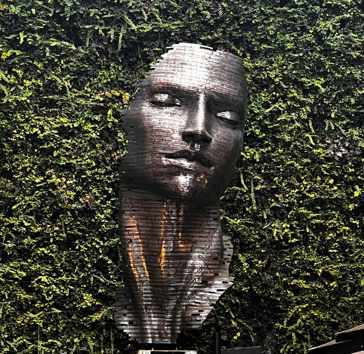 a large sculpture of a metallic head called Paraiso (Paradise), in James Court, Soho, London